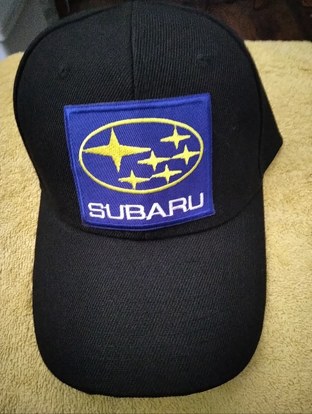 Black Subaru Patch Baseball Cap with Blue & Yellow Logo
